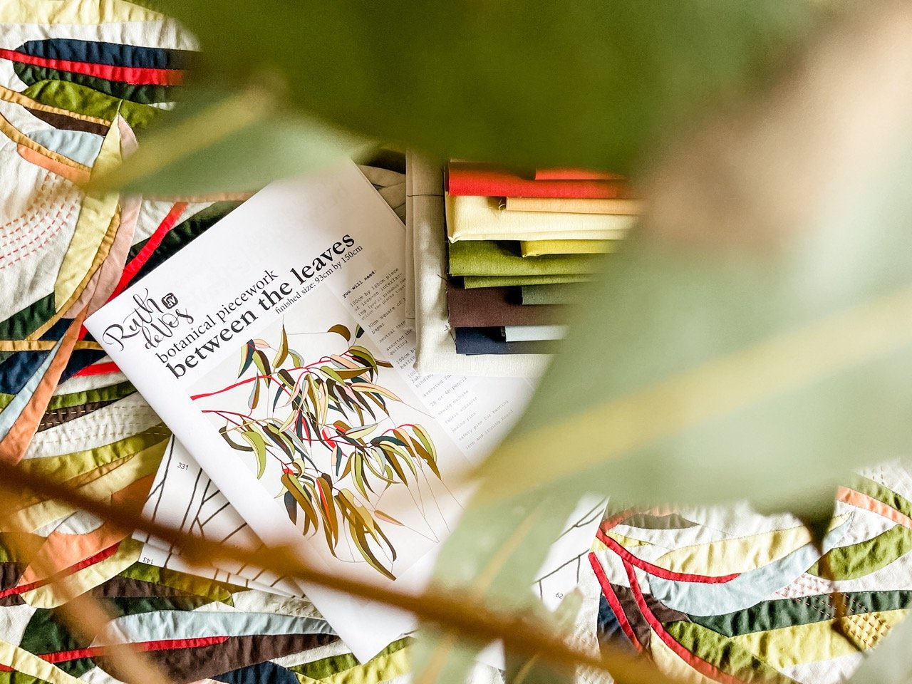 A quilt pattern featuring gum leaves